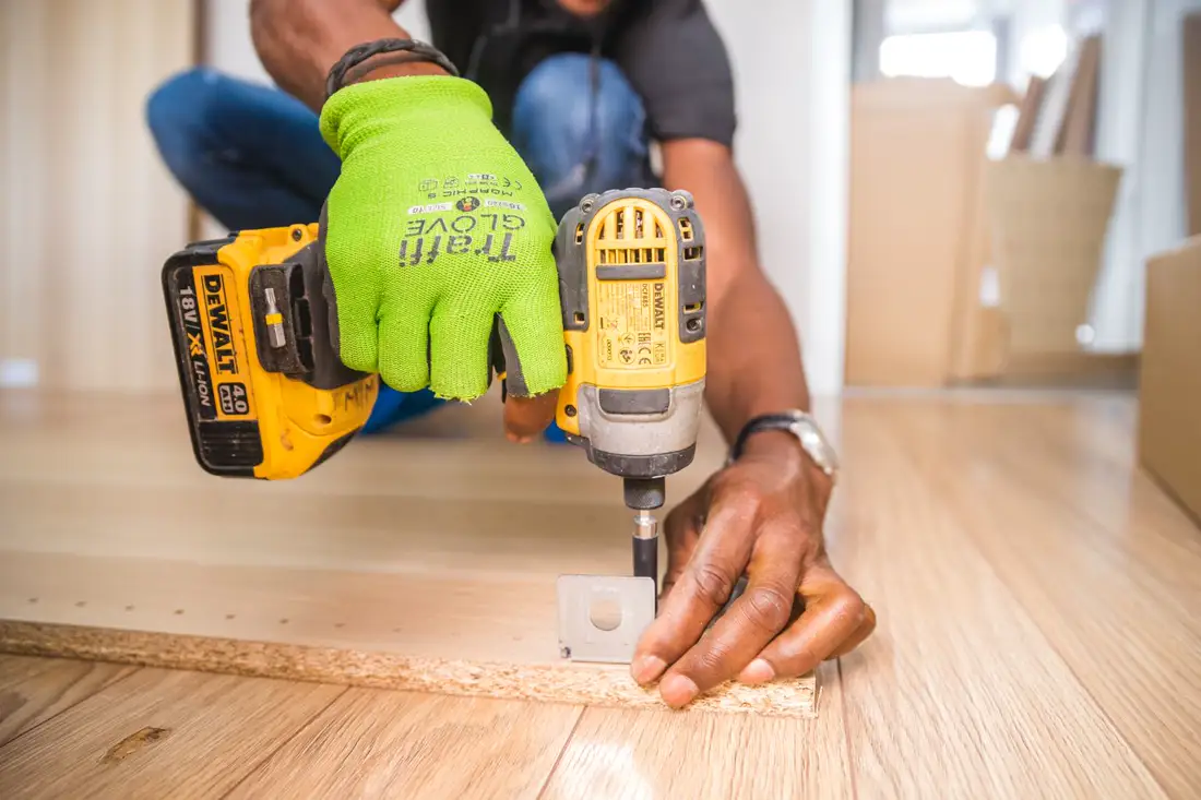 A drill and a level on a job site