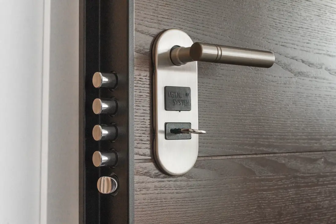 A door lock and keys on a workbench